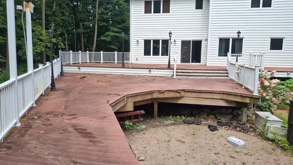 An older wood deck with worn boards before rebuild